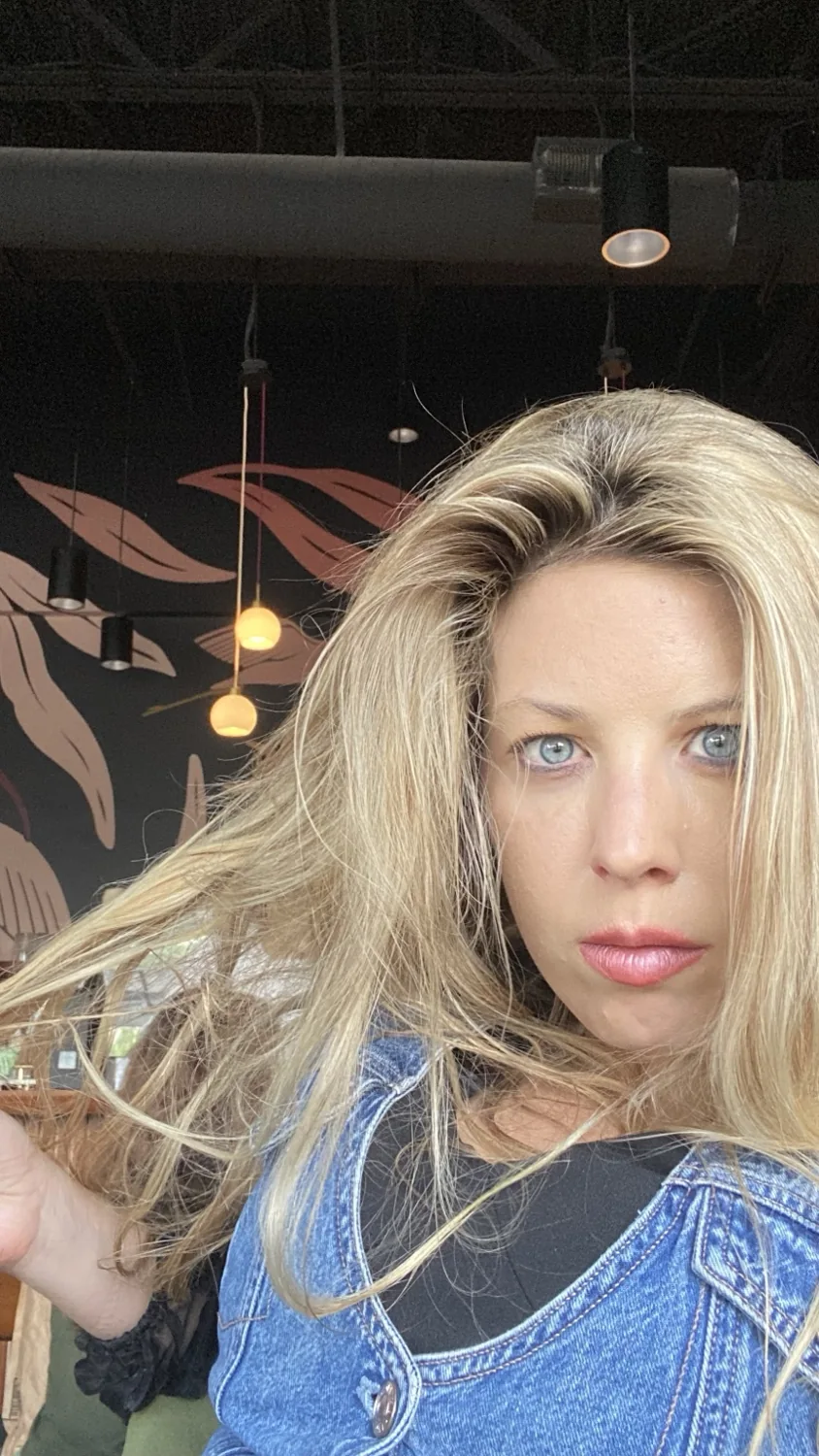 Jennifer in denim, looking directly toward the camera