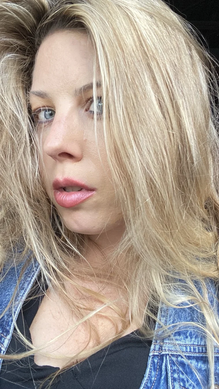 Close-up portrait of Jennifer in a denim outfit